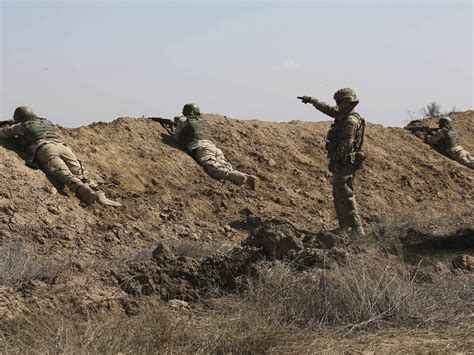 taji rusk|UK soldier and two Americans killed in rocket attack in Iraq .